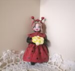 Девочка в костюме Божья Коровка