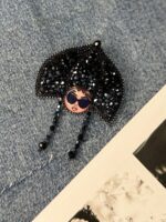 Брошь " Модная матрешка"