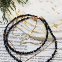 Чокер из темно - синих бусин с золотыми акцентами — стиль и элегантность в каждой детали Откройте для себя очарование утончённого аксессуара — чокера, выполненного из мелких блестящих темно - синих камушков, искусно переплетённых с изящными золотыми элементами в виде цепочки и вставок натурального гематита. Этот аксессуар станет настоящей изюминкой вашего образа, добавляя нотку роскоши и загадочности. Особенности: Дизайн: лаконичный, но выразительный. Синие бусины создают глубокий, насыщенный контраст с золотыми вставками, которые придают украшению особый шарм. Застёжка: надёжная и стильная — выполнена в золотом цвете, гармонично дополняя общий дизайн. Материал: высококачественные бусины гранёного ювелирного стекла, натуральный гематит, цепочка стойкого золотого покрытия и фурнитура обеспечивают долговечность и комфорт при ношении. Длина:  48 см + цепочка удлинитель 2 см, идеально регулируется, чтобы подчеркнуть линию шеи. Почему этот чокер стоит выбрать? Универсальность: подойдёт как к повседневному, так и к вечернему образу. Легко сочетается с одеждой разных стилей — от классики до кэжуал. Акцент на индивидуальности: добавит изюминку даже самому простому наряду, подчеркнёт вашу утончённость и чувство стиля. Идеальный подарок: изысканный и практичный аксессуар, который порадует любую модницу. Этот чокер — не просто украшение, а воплощение элегантности и современного вкуса. Позвольте себе добавить немного роскоши в повседневную жизнь!