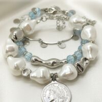 Браслет с жемчугом Майорка и сахарным кварцем: воплощение элегантности и индивидуальности Ищете украшение, которое подчеркнёт вашу утончённость и добавит нотку роскоши в любой образ? Представляем вам эксклюзивный браслет, сочетающий в себе изысканность жемчуга, нежность кварца и изящество серебряных элементов. Почему этот браслет заслуживает вашего внимания? · Роскошный дизайн. Крупные жемчужные бусины неправильной формы создают ощущение природной гармонии и уникальности. Нежно-голубой кварц напоминает о морском бризе и добавляет свежести образу. · Сочетание материалов. Серебряные элементы разной формы (гладкие, фактурные, изогнутые) создают интересную игру линий и текстур, делая браслет по-настоящему уникальным. · Особая деталь — монета-подвеска. Центральный элемент украшения — стилизованная монета с рельефным изображением. Она придаёт браслету винтажный шарм и делает его настоящим акцентом в образе. · Универсальность. Этот браслет легко сочетается как с повседневной одеждой, так и с вечерними нарядами. Он подойдёт для офиса, романтического ужина или торжественного мероприятия. · Три в одном. Этот аксессуар можно разделить на три самостоятельных браслета. Можно носить все сразу или по оному... Все, как пожелает ваше настроение · Качество исполнения. Каждый элемент тщательно подобран и надёжно закреплён. Браслет удобен в носке и не теряет внешний вид со временем. Идеальный подарок! Ищете подарок для особенной женщины? Этот браслет станет символом вашей заботы и внимания. Он подойдёт как для молодой девушки, так и для зрелой дамы, ценящей классику и элегантность. Не упустите возможность пополнить свою коллекцию украшений настоящим произведением искусства! Добавьте этот браслет в корзину уже сегодня и позвольте себе наслаждаться его красотой каждый день. Для заказа и по всем вопросам обращайтесь Телефон: +79817339605 WhatsApp: wa.me/79817339605 Группа в Telegram: t.me/LanaMir03 Сообщения группы VK: vk.me/lanamirc Группа VK, где вы найдете еще больше украшений: https://vk.com/lanamirc Или можно оформить заказ и задать вопрос прямо здесь, на нашем маркетплейсе https://marketcraft.ru/store/lanamir/ Нас находят по запросам: Браслет ручной работы, жемчуг, кварц, сахарный кварц, серебро, бусины, подвеска-монета, винтажный стиль, элегантность, украшение, женский аксессуар, ручная работа, изысканность, перламутр, голубые бусины, декоративные элементы, стильный браслет, ювелирное изделие, аксессуар для образа, дизайнерский браслет, браслет с камнями, тройной браслет